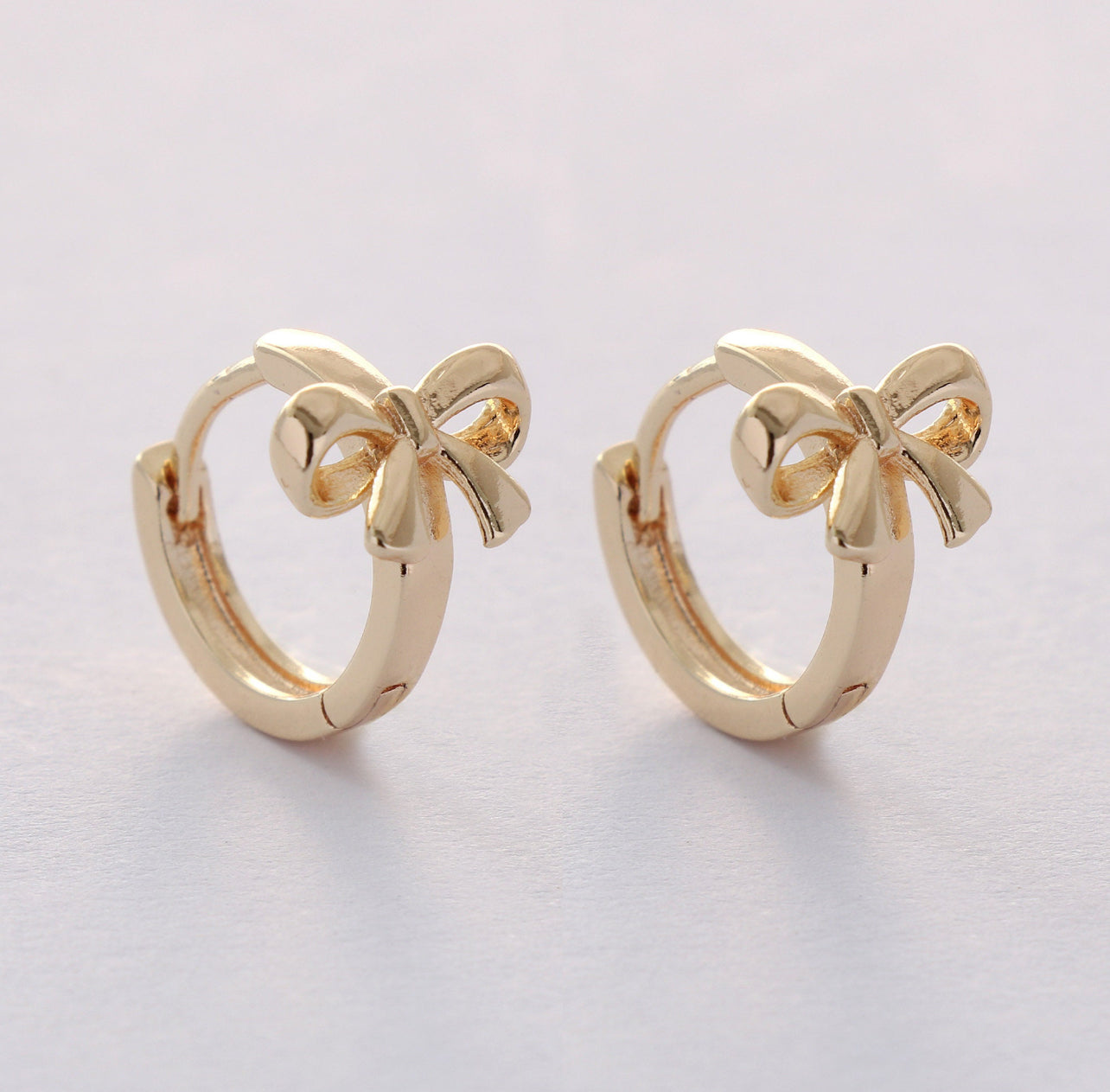 Gold Bow Huggie Hoops